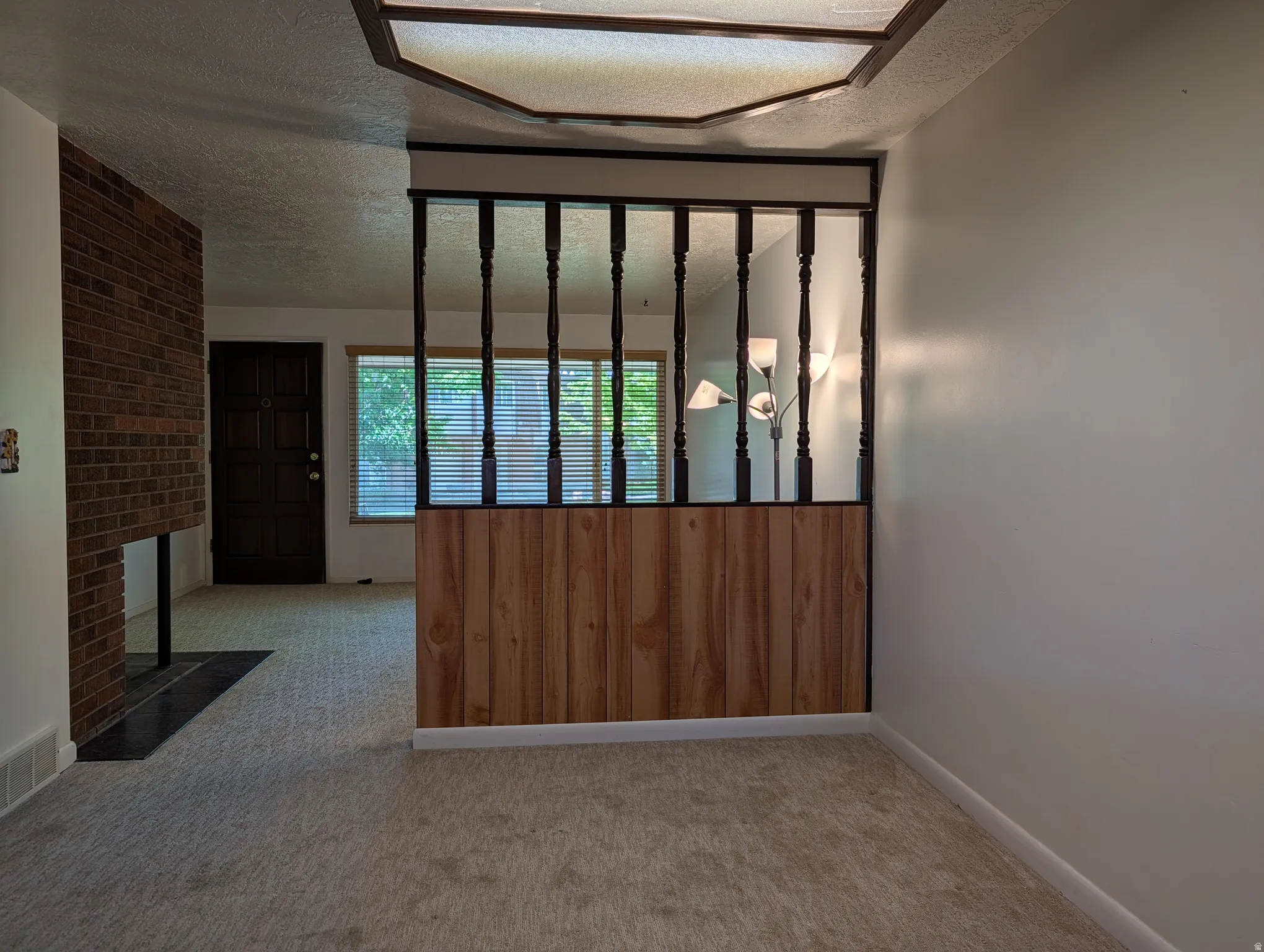 Interior space featuring light-colored carpeting and white walls