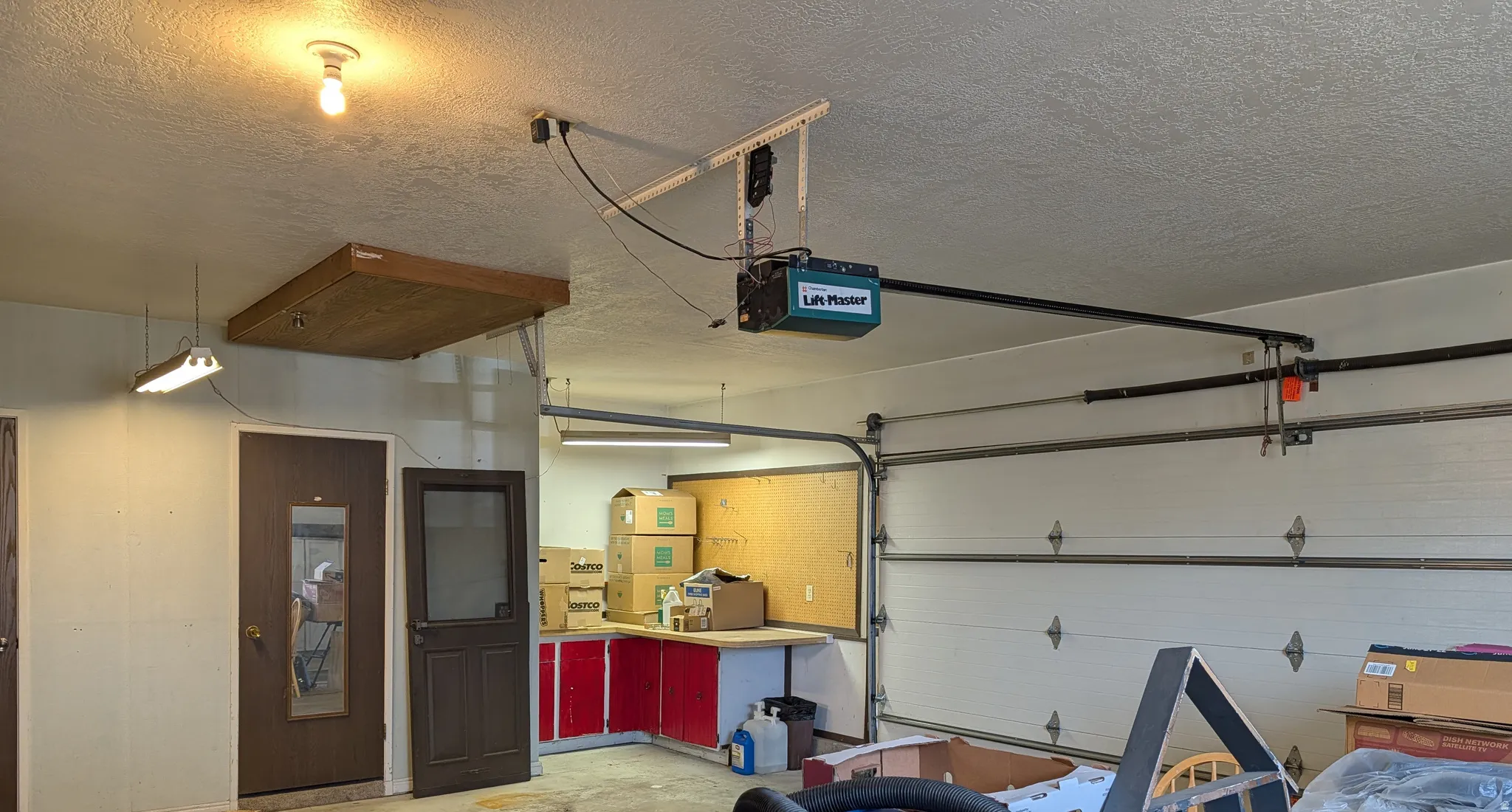 Garage featuring a garage door opener