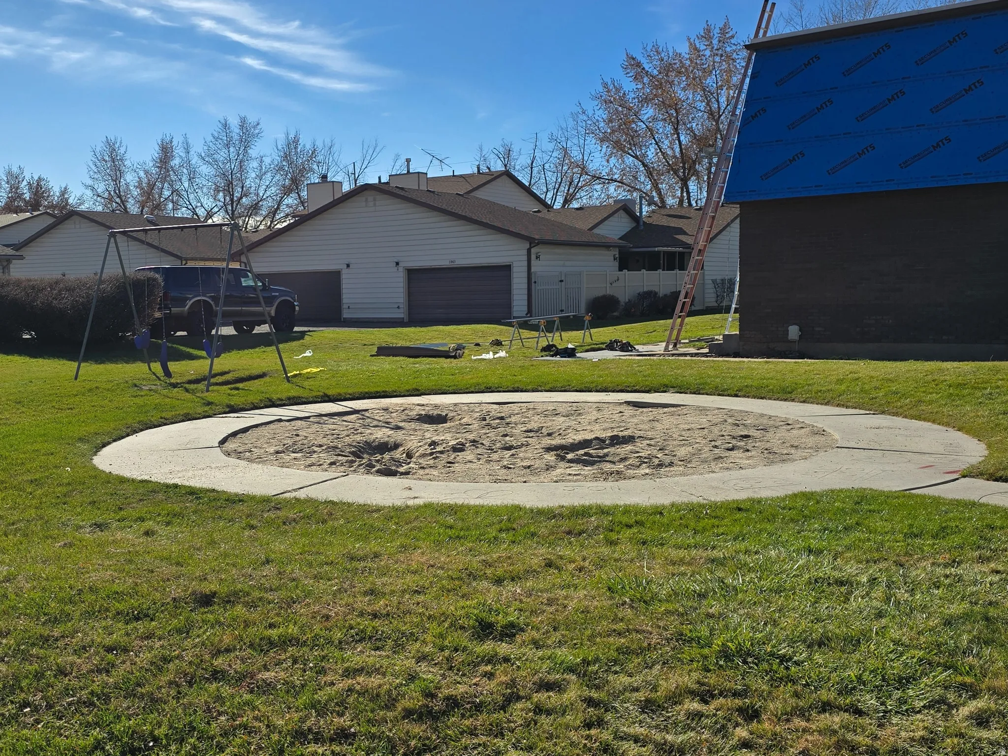 Grassy playground Swing and Sandbox