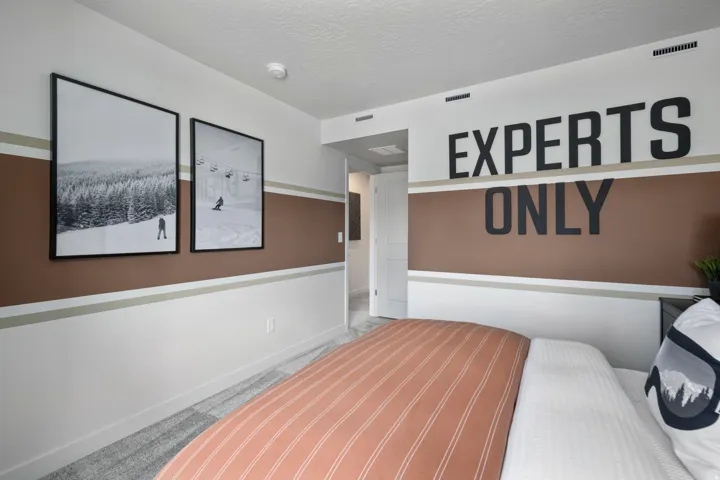 Bedroom with a textured ceiling and carpet