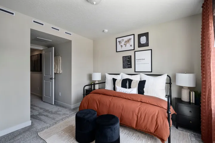 Bedroom with carpet floors and a textured ceiling
