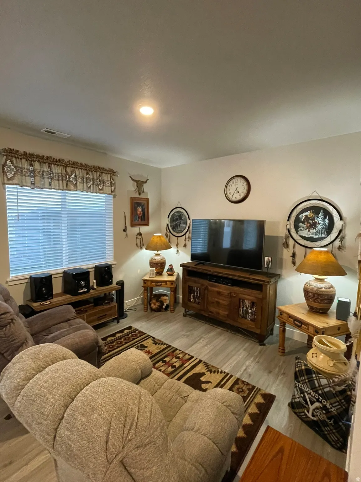 Living area featuring lvp flooring and recessed lighting