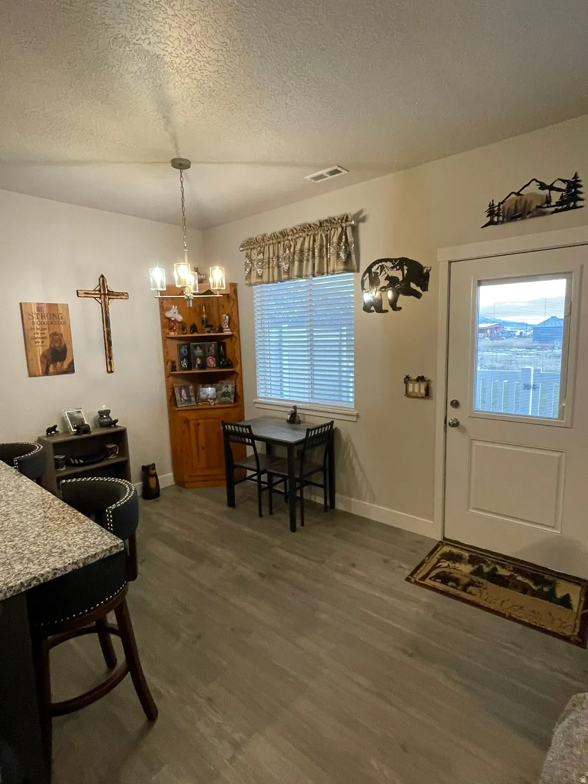 Dining area featuring, a chandelier, and lvp flooring.