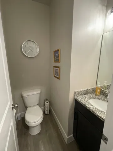 Half bath featuring vanity and lvp flooring