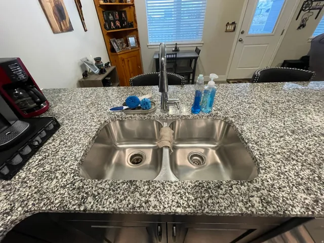 Kitchen view of granite countertops and a sink