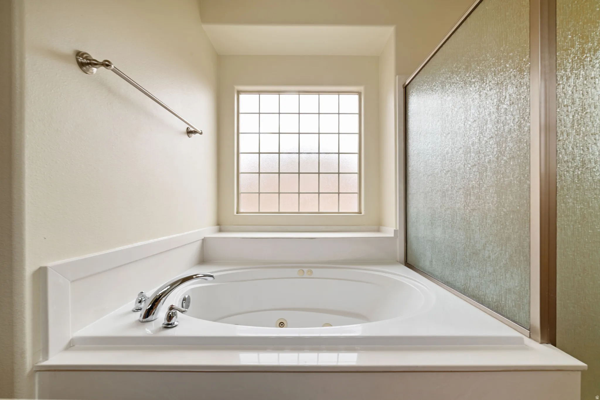 Full bath featuring a tub with jets