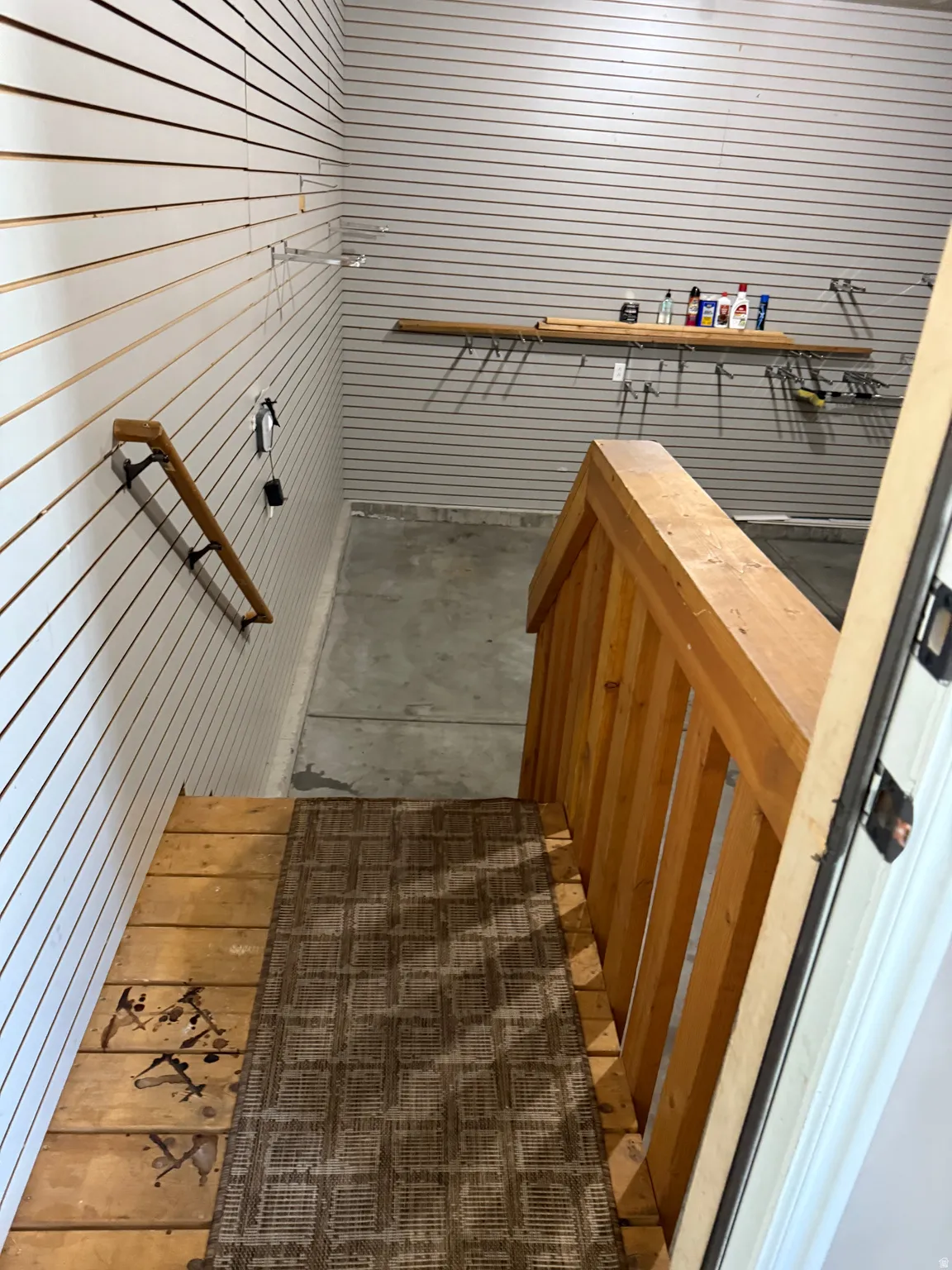 Stairs featuring wood walls