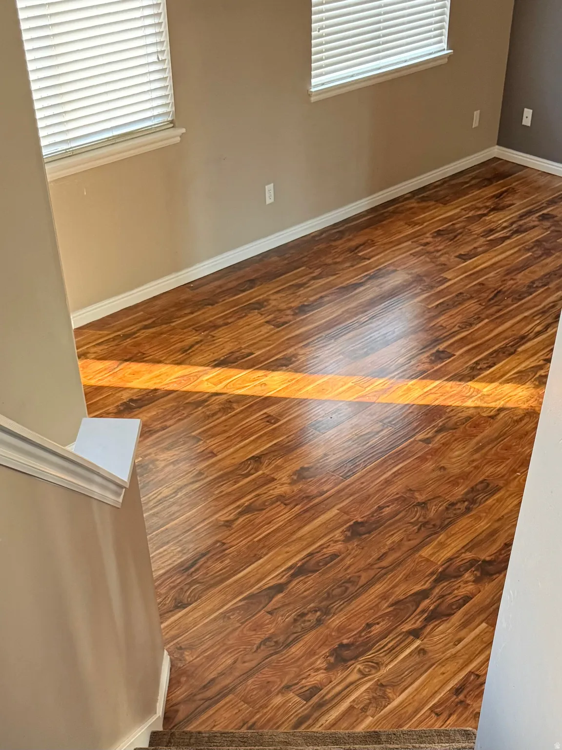 Detailed view of baseboards and wood finished floors