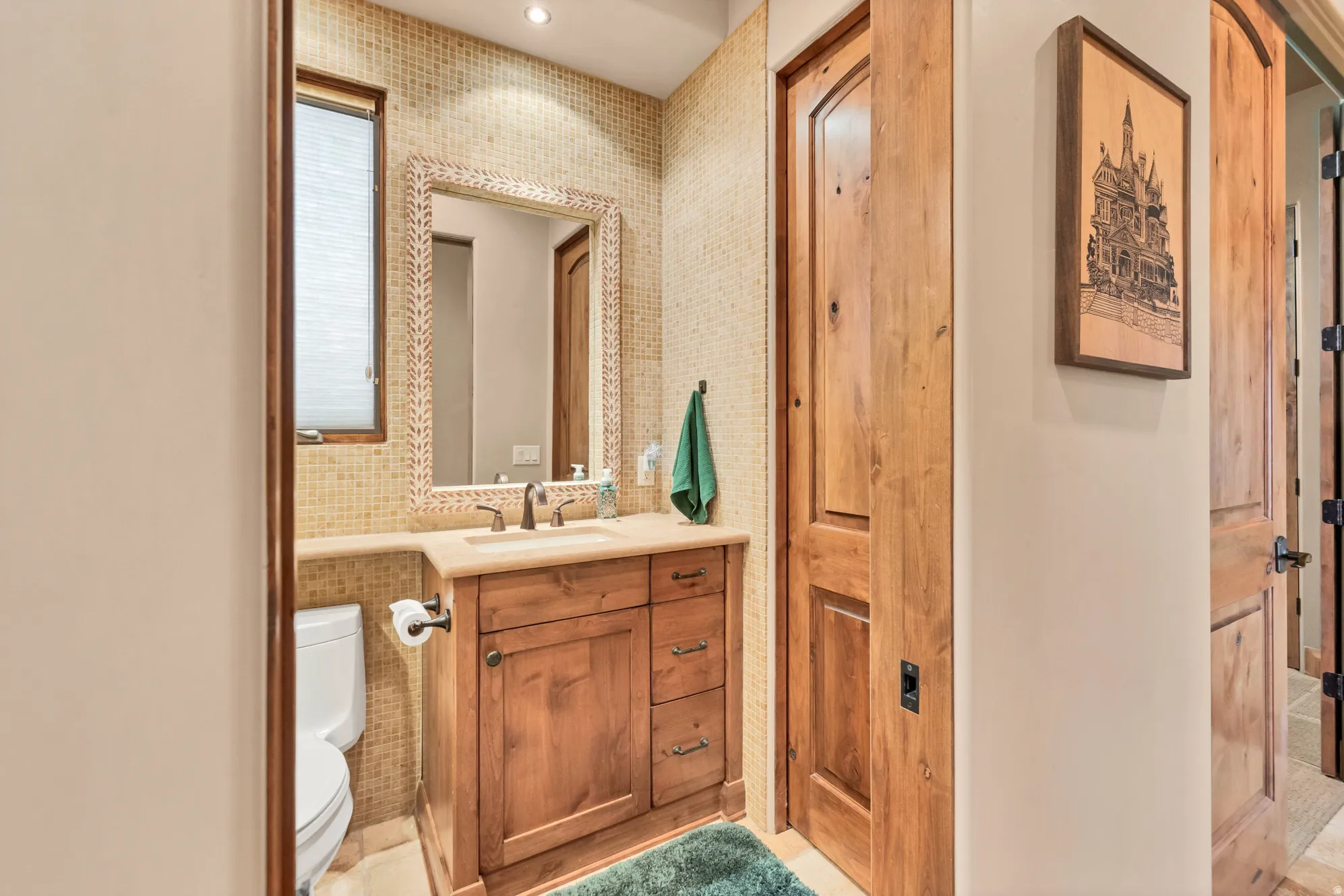 Bathroom with vanity and recessed lighting
