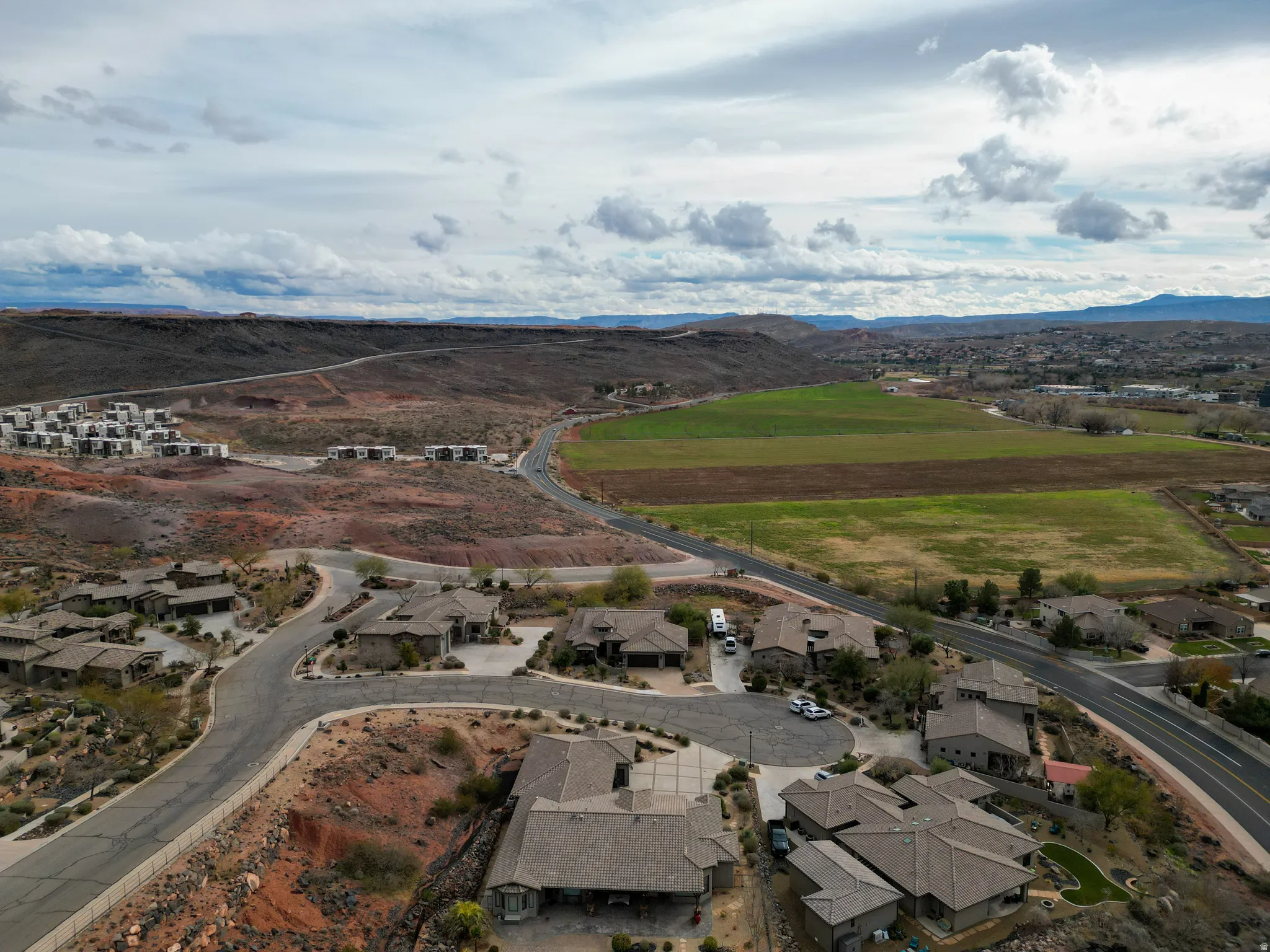 Aerial view of residential area with a mountainous background