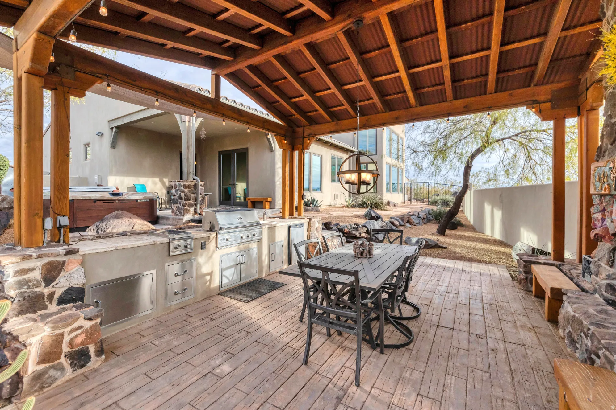 View of patio featuring area for grilling and outdoor dining space