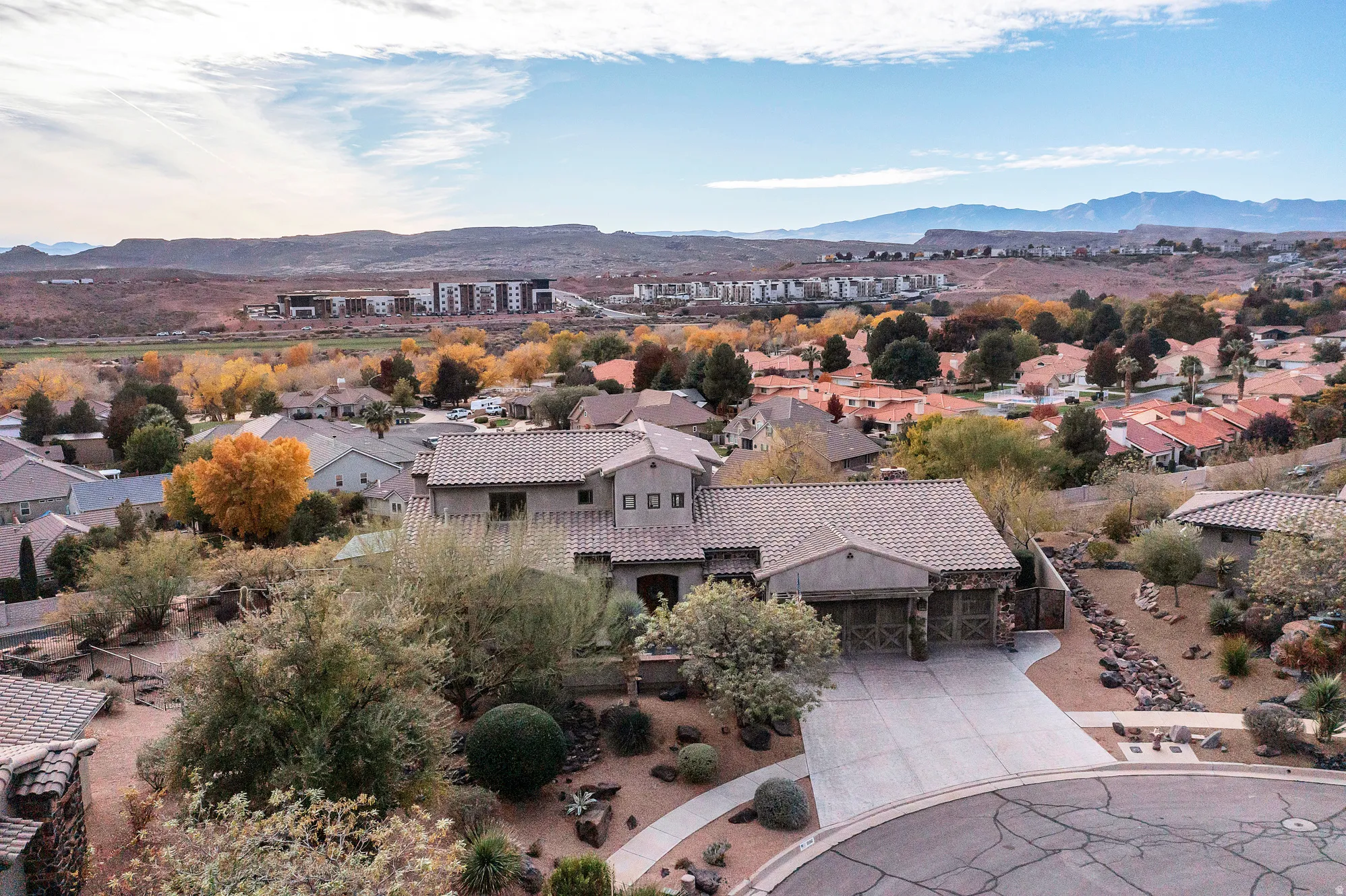 Aerial view of residential area featuring a mountainous background