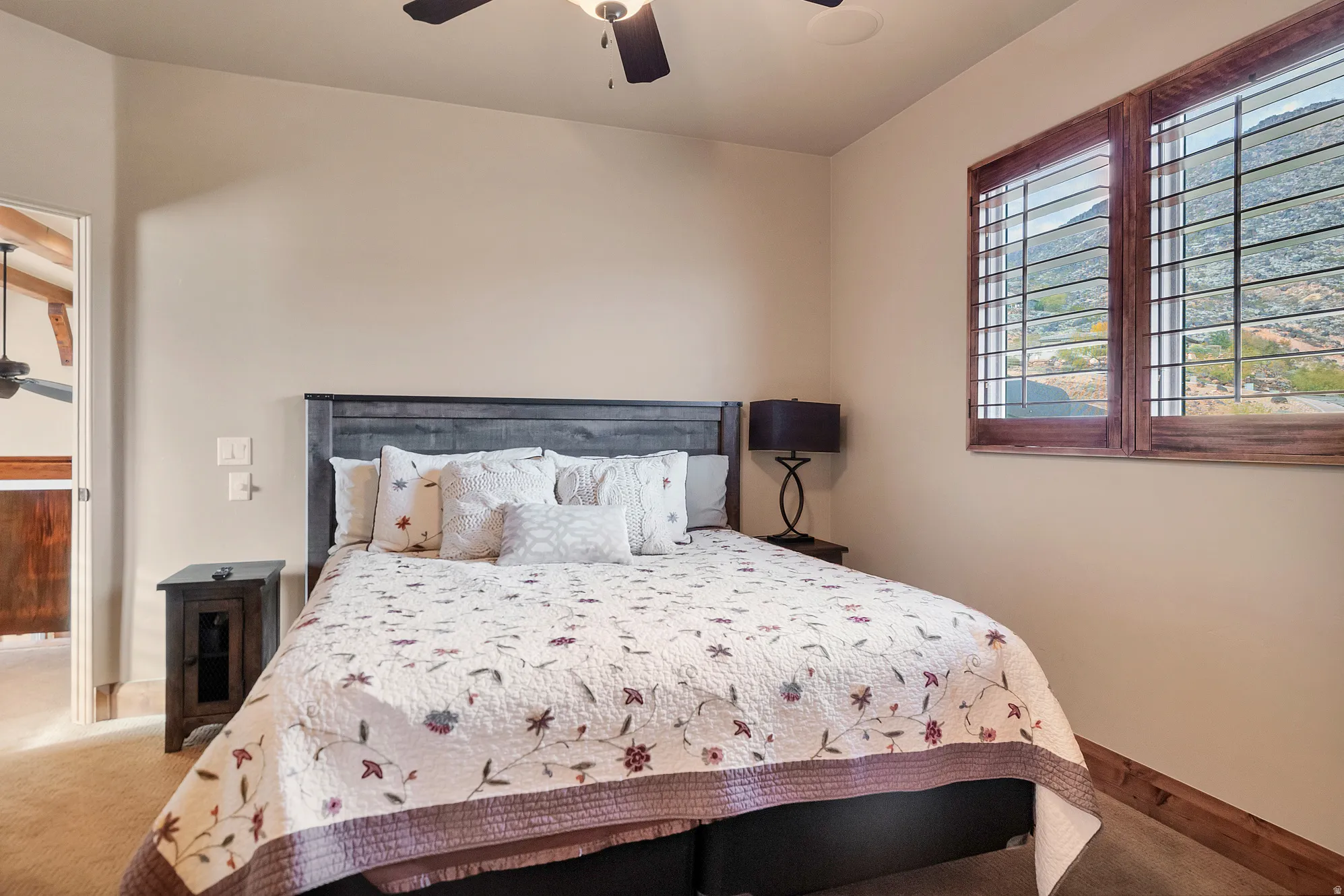 Bedroom with carpet flooring and a ceiling fan