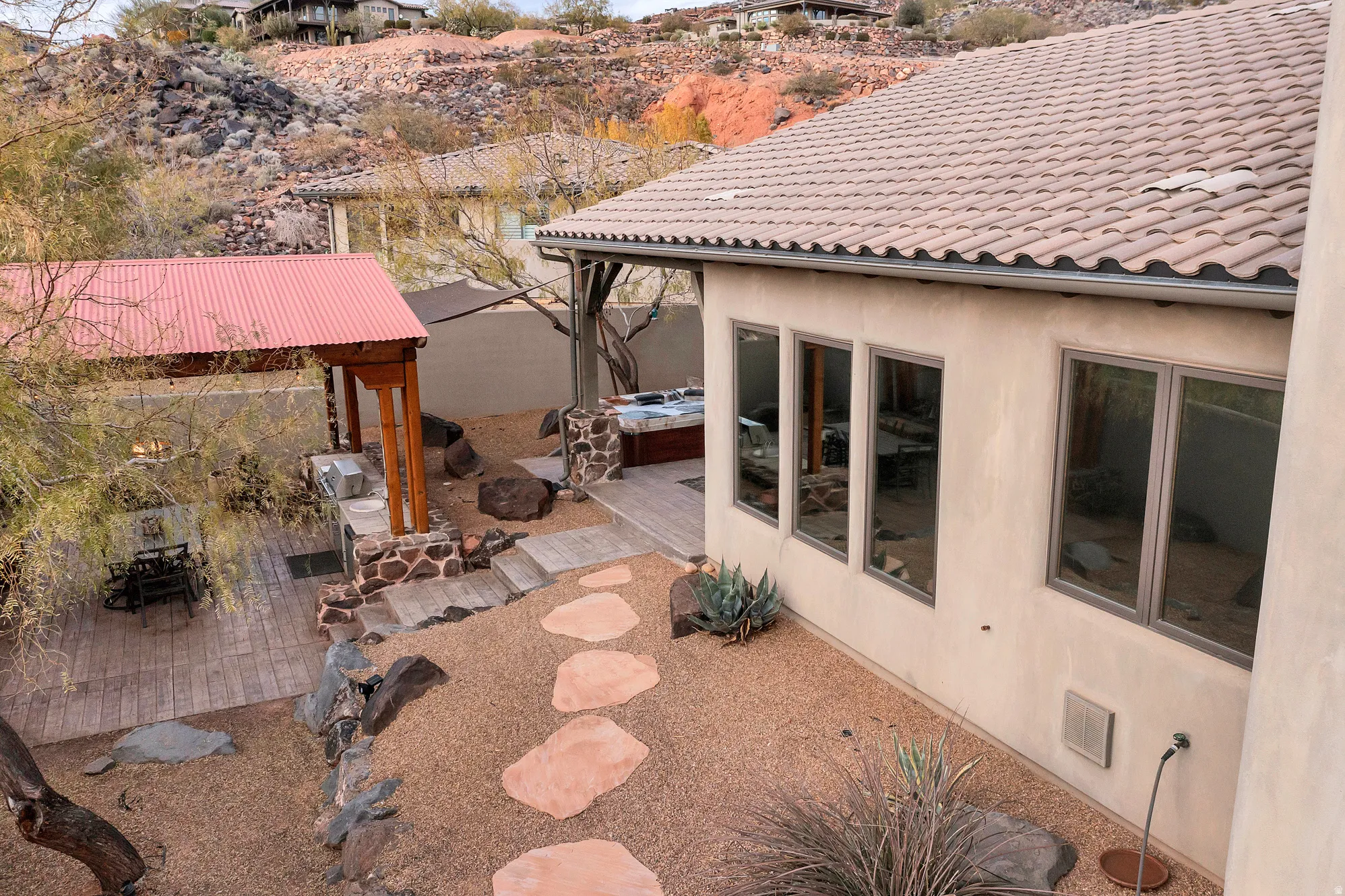 View of patio with a hot tub