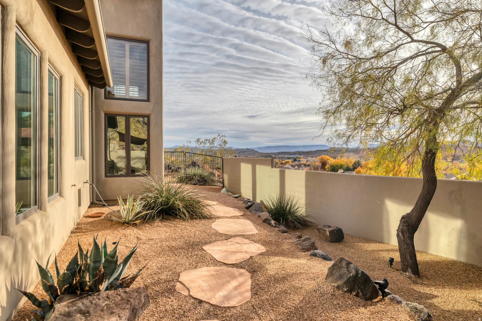 Fenced backyard featuring a mountain view