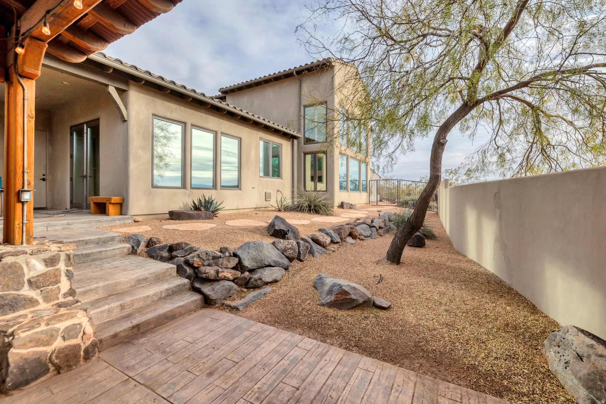 Back of house featuring a patio area and stucco siding