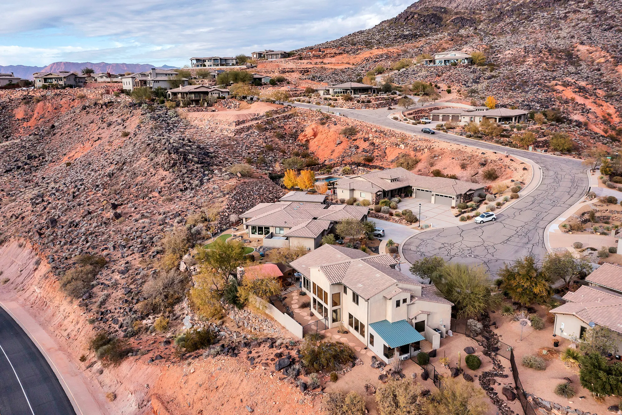 Aerial view of property's location featuring mountains and nearby suburban area