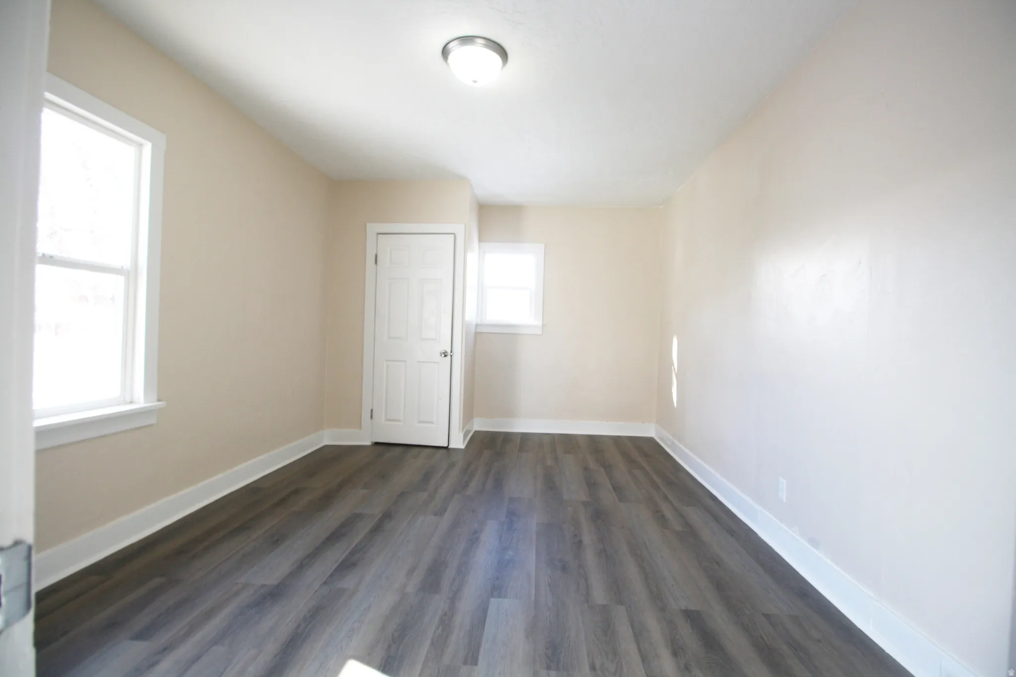 Bedroom 3 with baseboards and dark wood finished floors