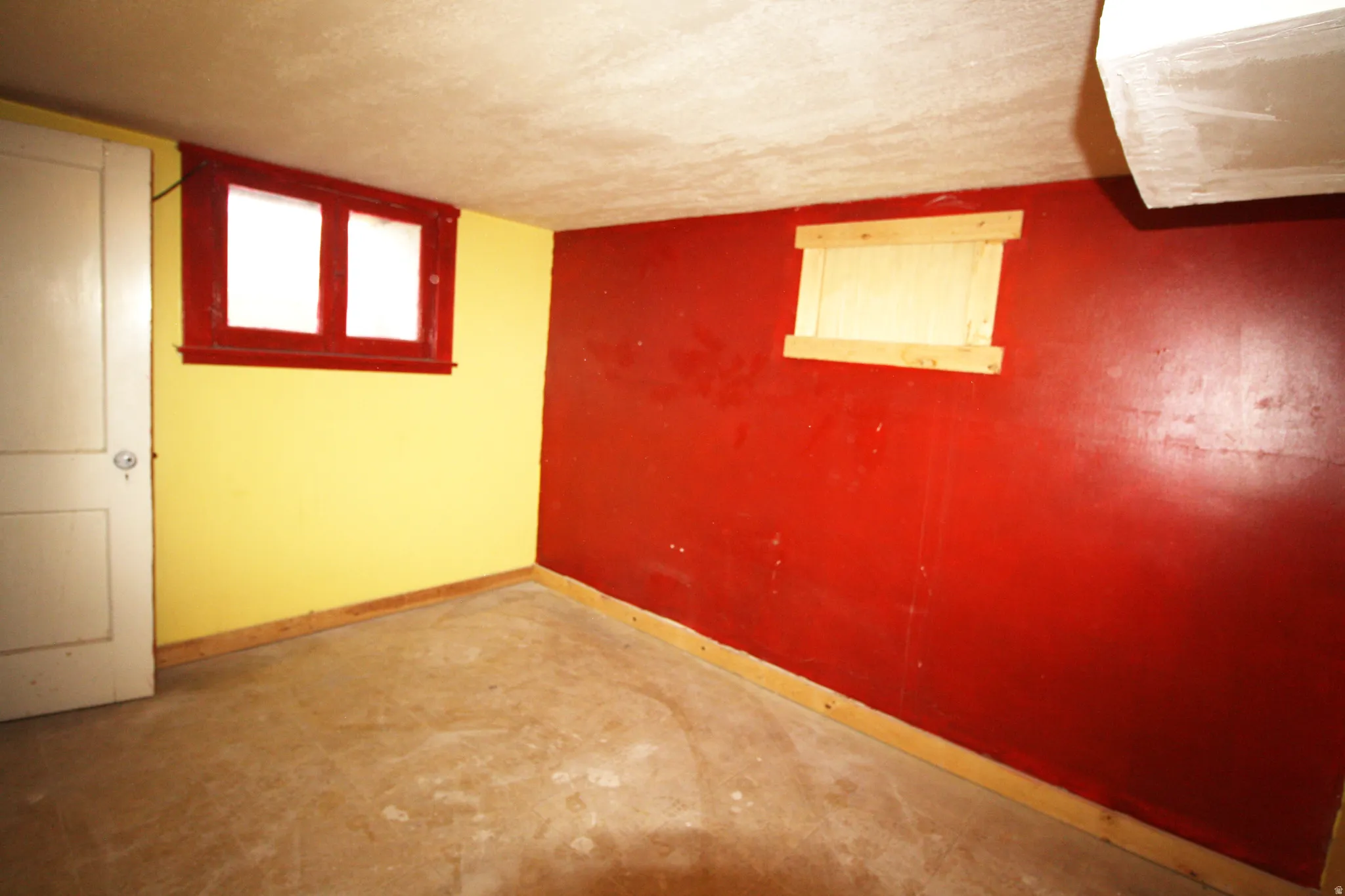Basement Bedroom 5 featuring a textured ceiling and baseboards