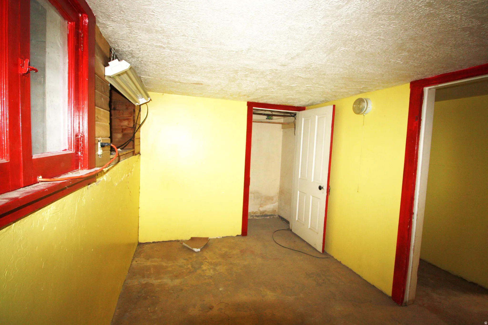 Basement Bedroom 4 featuring a textured ceiling