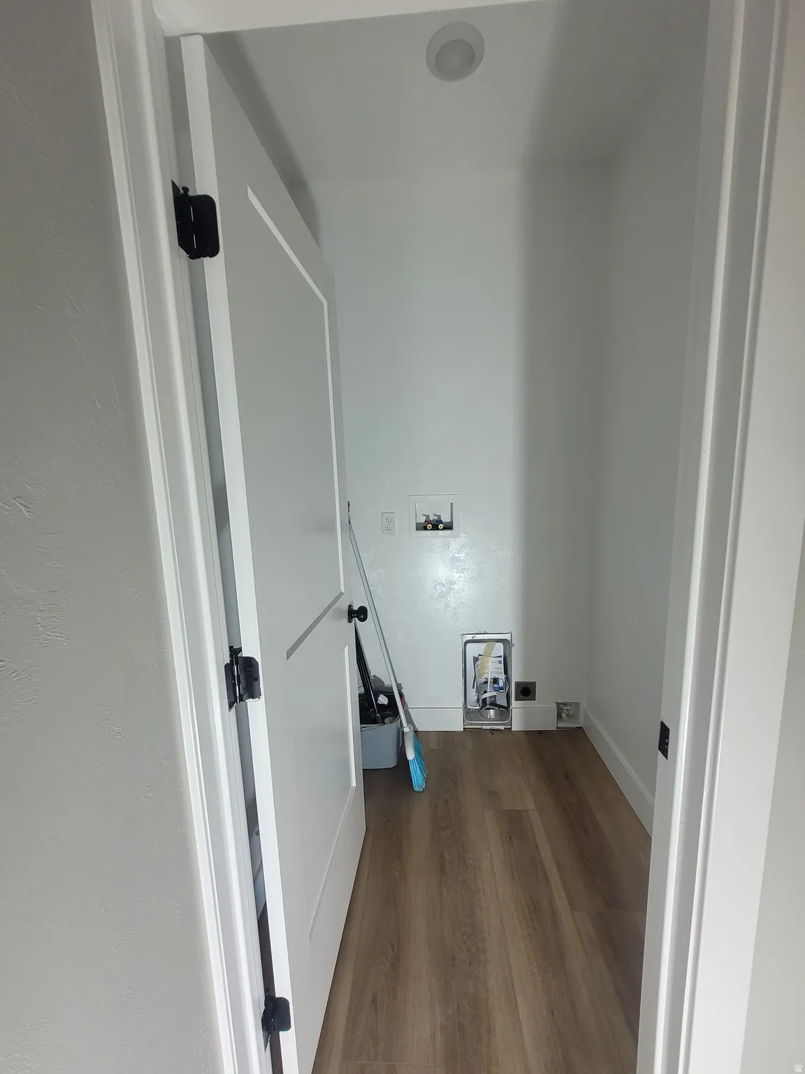 Laundry room featuring hookup for a washing machine and dark wood-style flooring