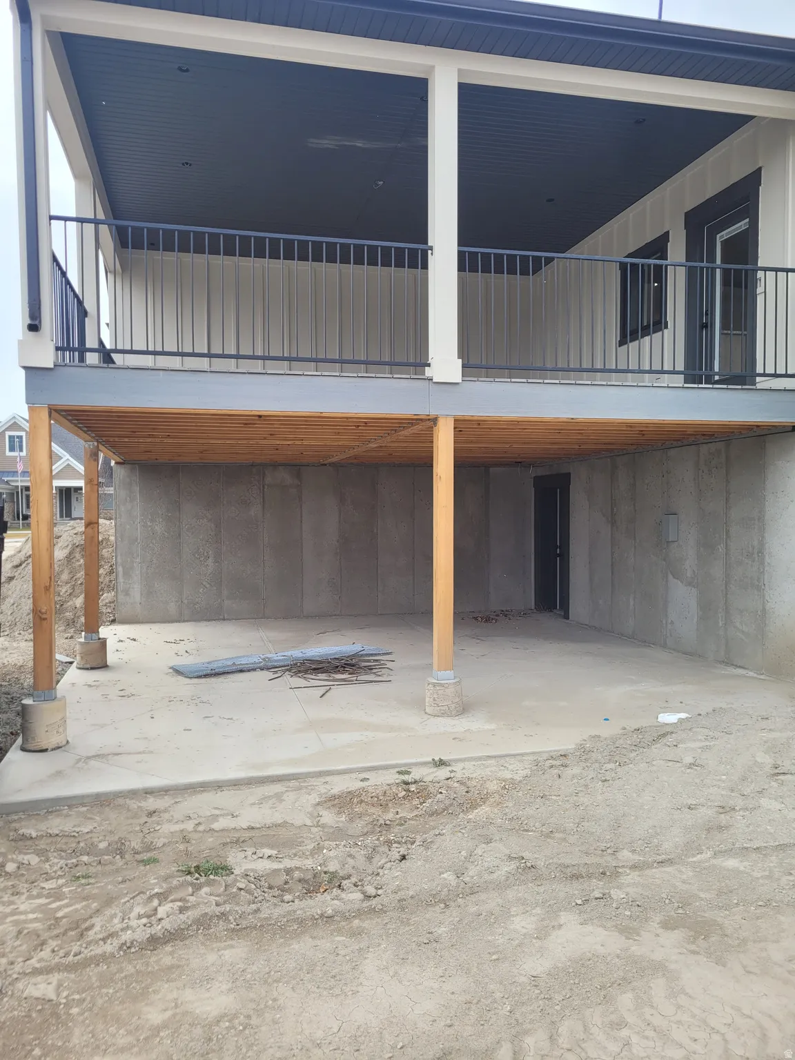 Exterior space with a carport and a balcony