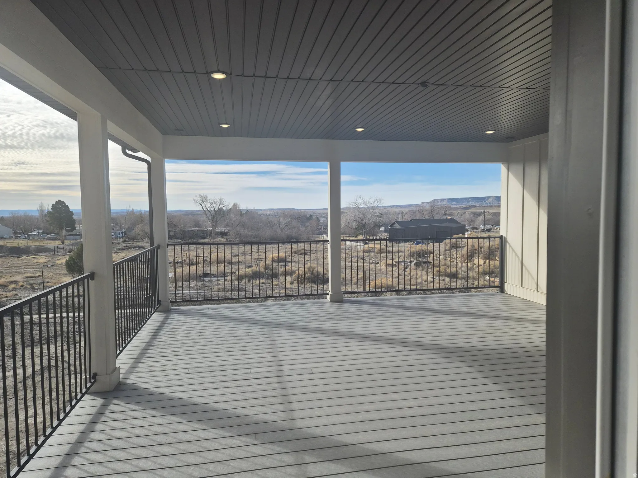 Wooden deck featuring a patio