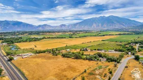 View of mountain backdrop with rural landscape