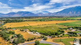 Aerial view of sparsely populated area featuring a mountain backdrop