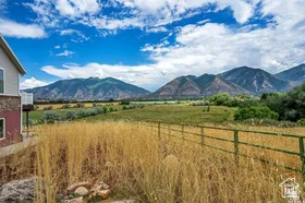 View of mountain background featuring rural landscape