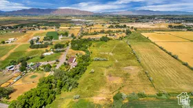 View of property location featuring rural landscape, farmland, and a mountainous background