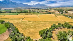Aerial view of sparsely populated area with a mountainous background