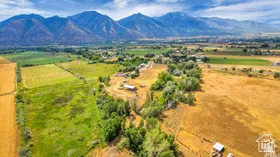 View of mountain background with rural landscape and farmland