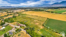 Overview of rural landscape featuring a mountainous background