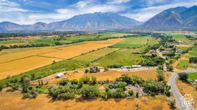 Aerial view of sparsely populated area with a mountain backdrop