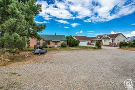 Ranch-style home featuring driveway and a residential view