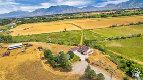 Aerial view of sparsely populated area with a mountainous background