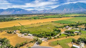 Aerial view of sparsely populated area with a mountain backdrop