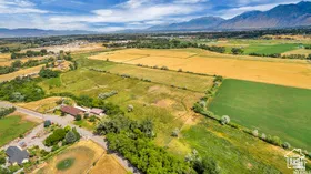 Aerial view of sparsely populated area featuring a mountainous background