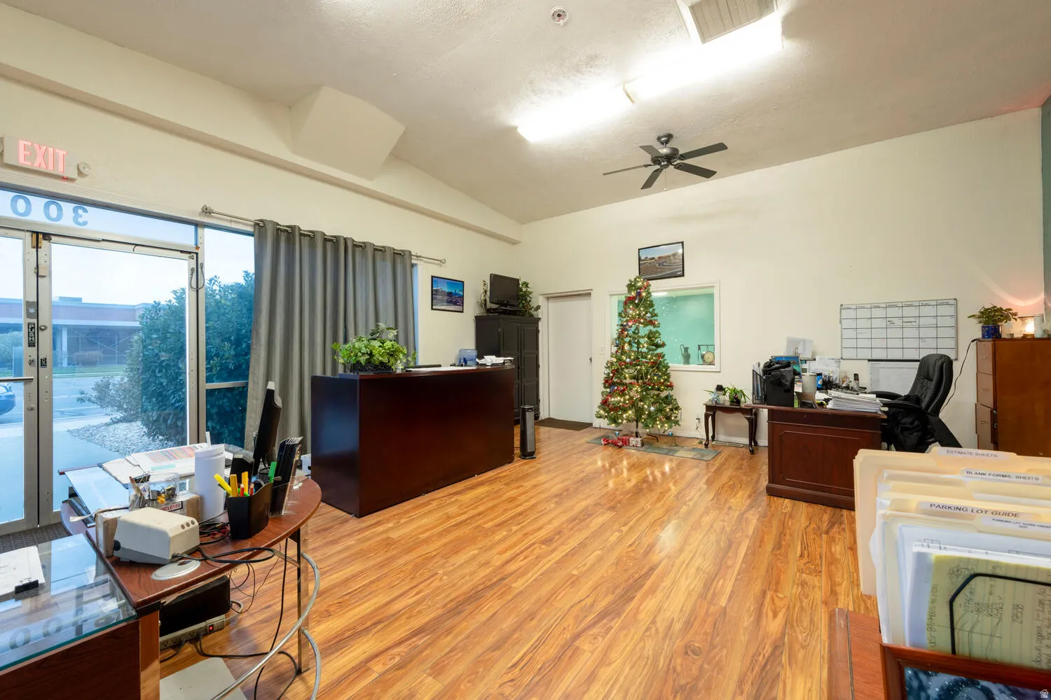 Office space featuring lofted ceiling and ceiling fan