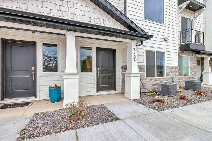 Entrance to property featuring stone siding