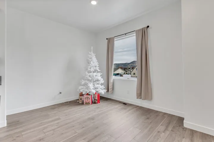 Spare room with light wood finished floors and baseboards