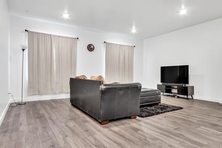 Living area featuring wood finished floors and baseboards