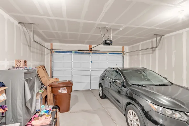 Garage featuring a garage door opener