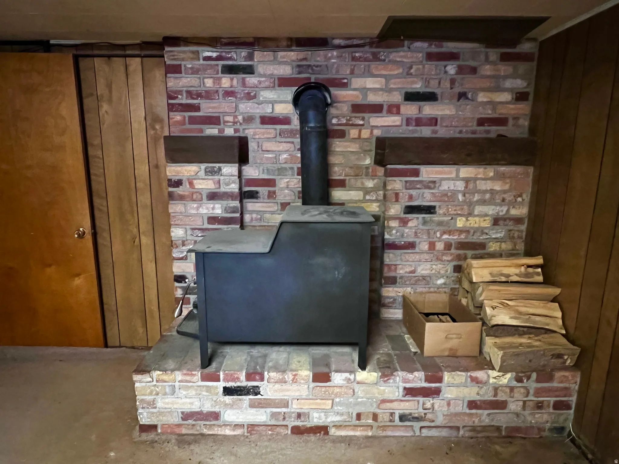 Detailed view of a wood stove and wood walls