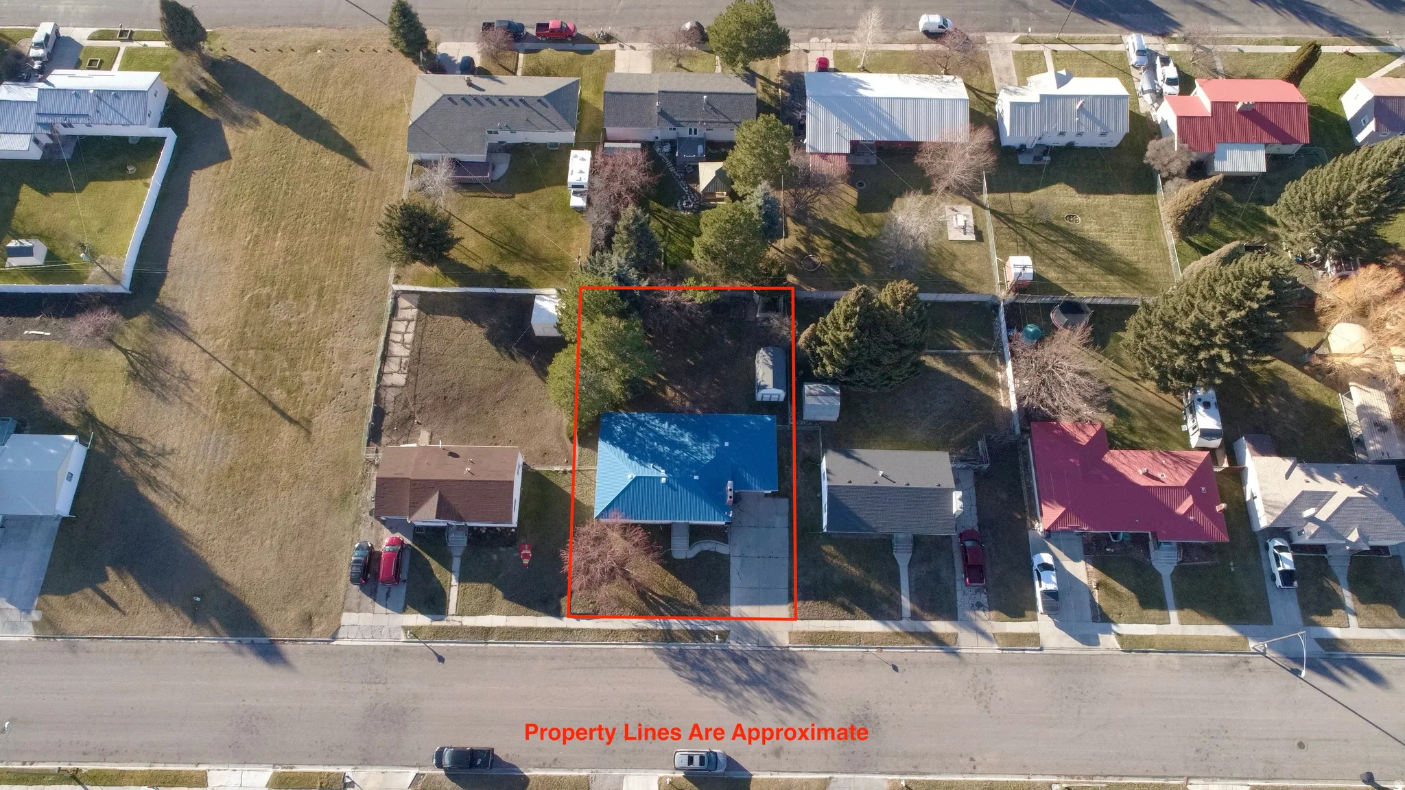 Aerial view of residential area with property boundaries highlighted