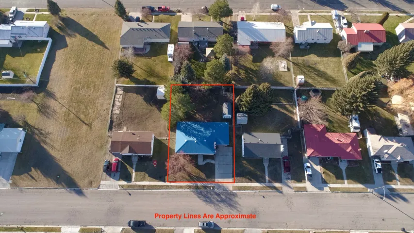 Aerial view of residential area with property boundaries highlighted