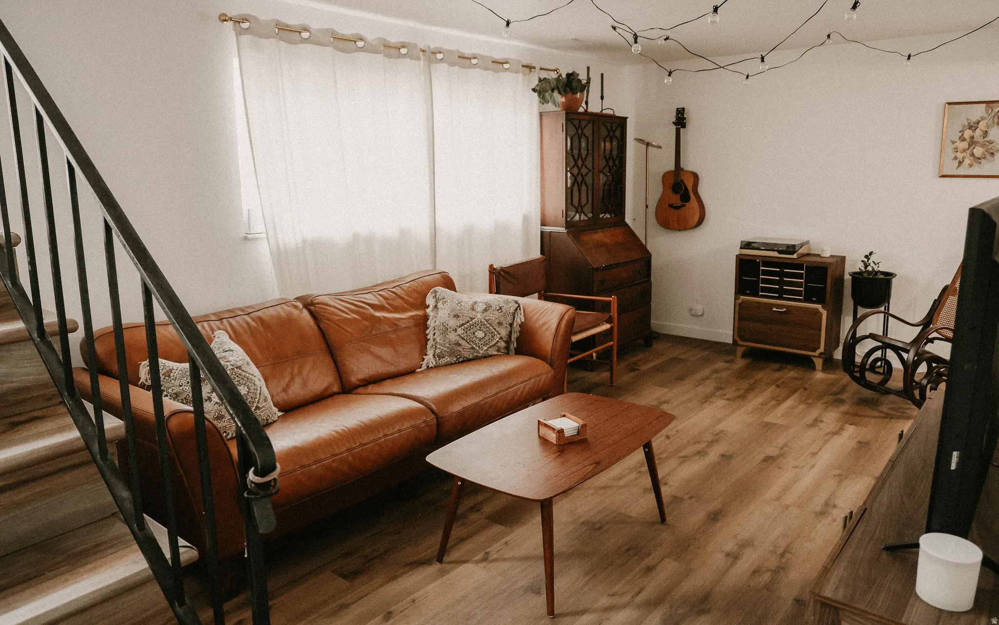 Living area with wood finished floors and stairs