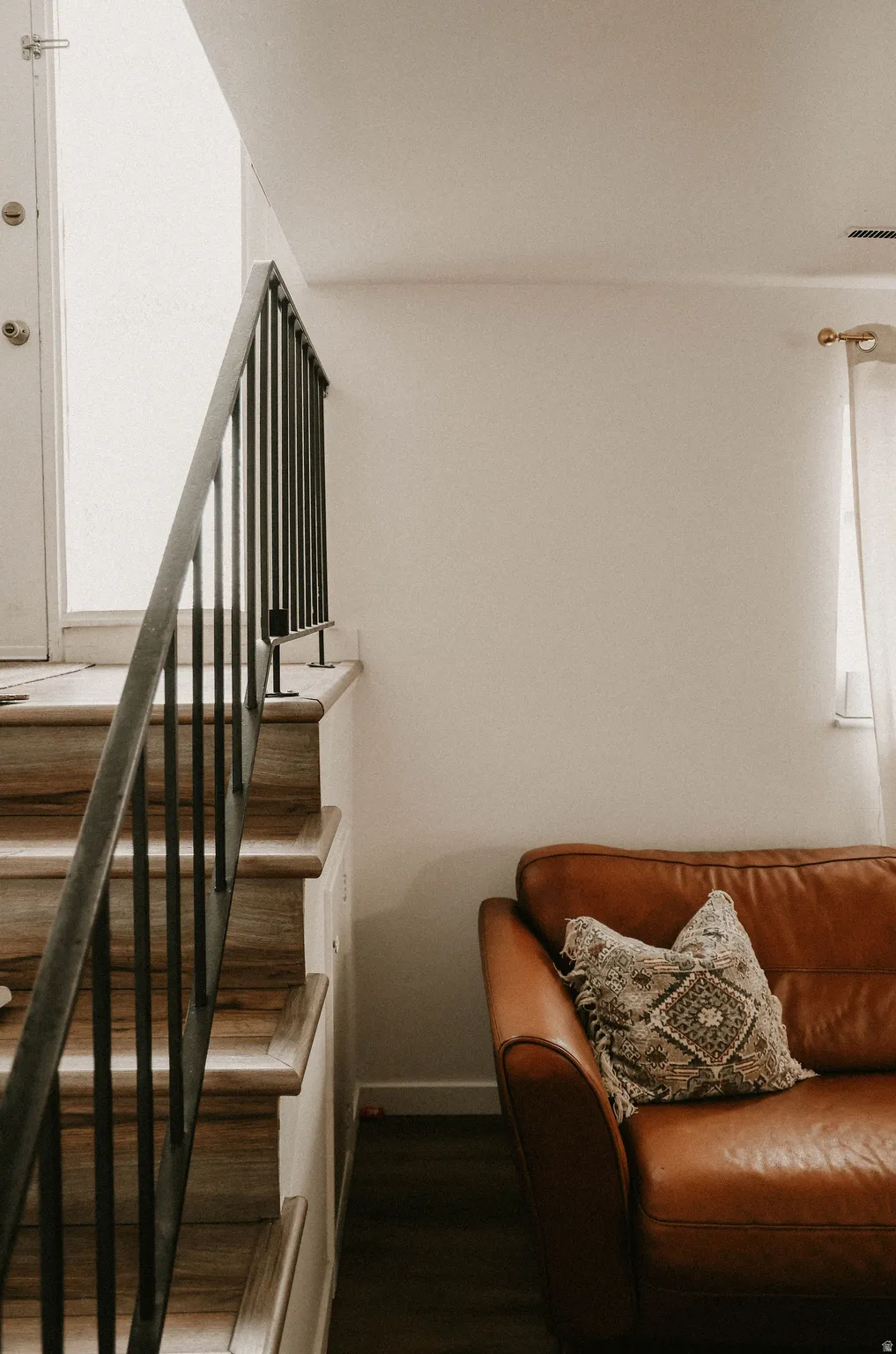 Stairs featuring wood finished floors and baseboards