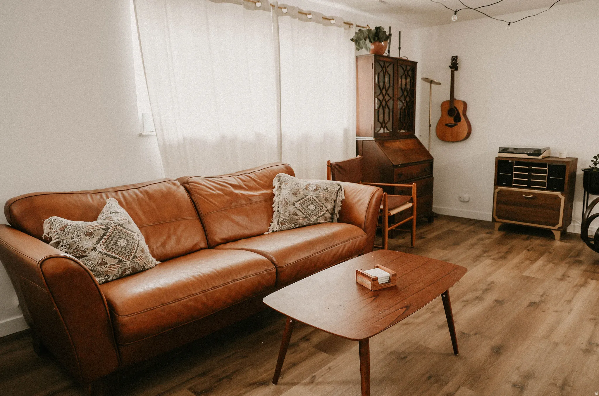 Living room featuring wood finished floors and baseboards